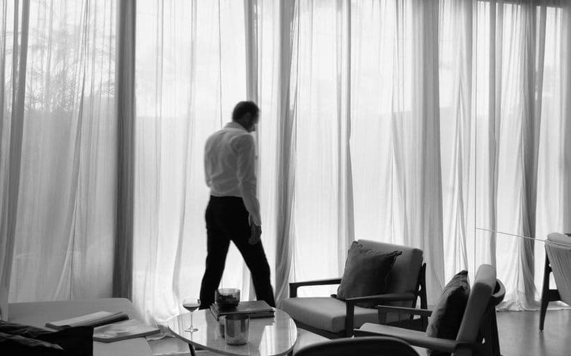 A guest at the window of a suite