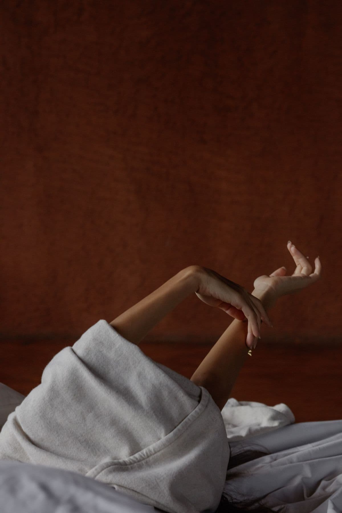 A guest stretching in white linen