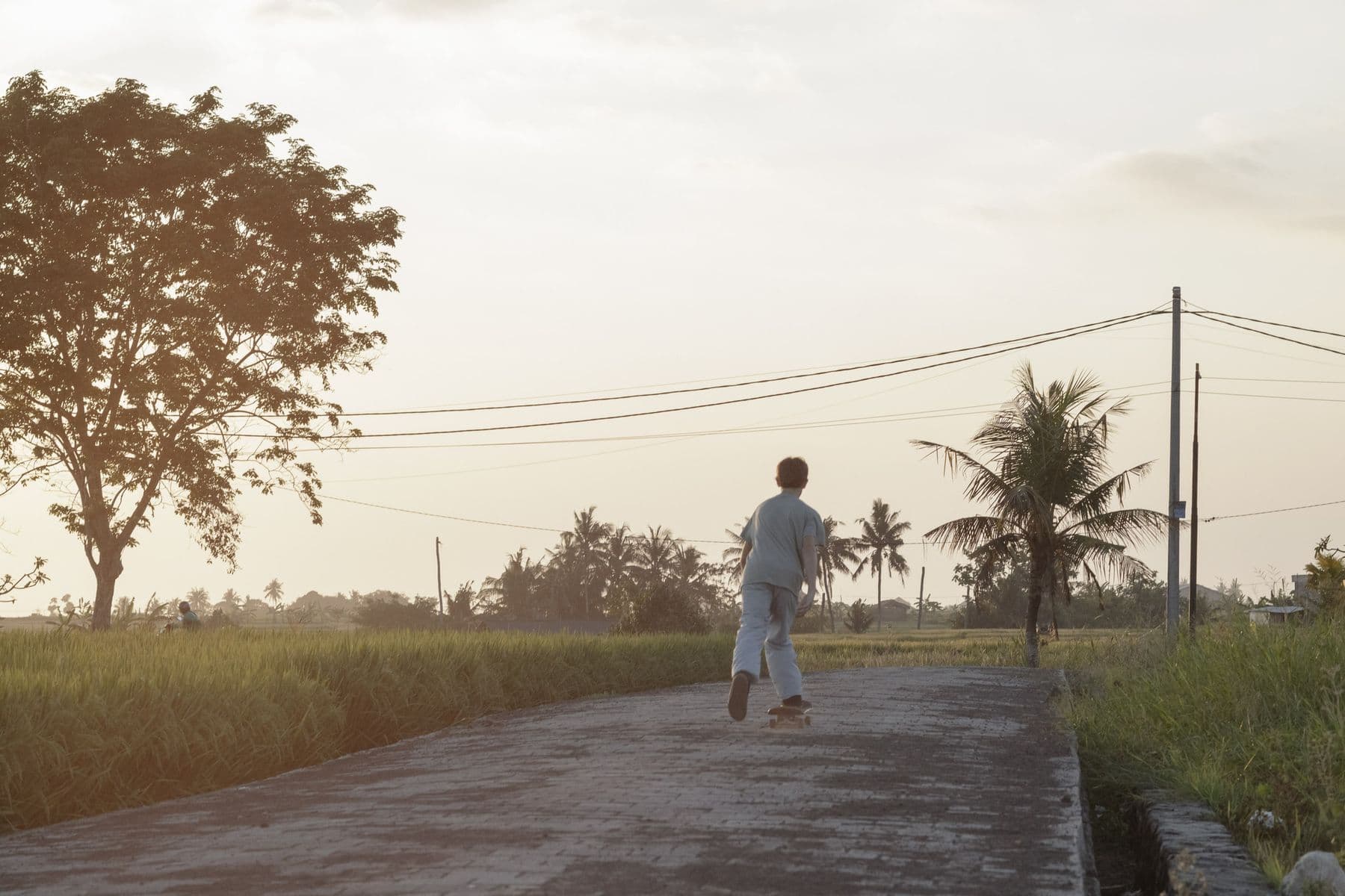 A walk along a village road at sunrise